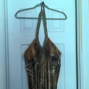 Backless dress. Ties around neck. Vintage. Very different. A little heavy.